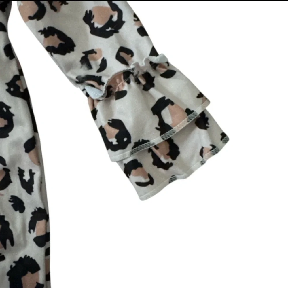 Boutique Clover cottage collection. Leopard Print Ruffle Sleeve Jumpsuit. 0-6mon
